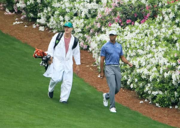 Tiger Woods walks with his caddie Joe LaCava on the 13th hole during a practice round at Augusta. Picture: Andrew Redington/Getty Images