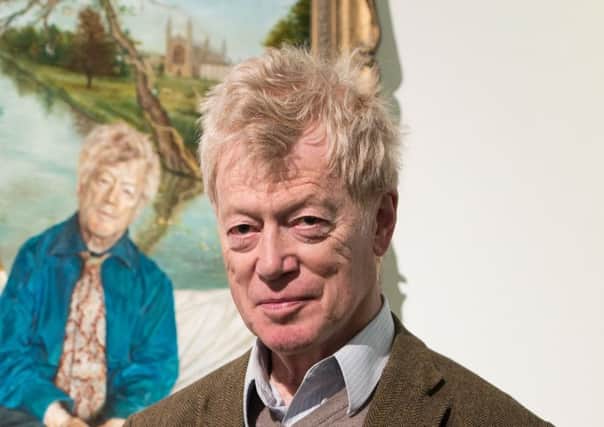 Sir Roger Scruton poses next to his portrait painted by artist Lantian D. Picture: Ian Gavan/Getty Images