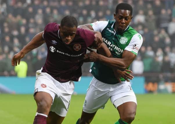 Hibernian's Marvin Bartley, right, with 
Hearts' Uche Ikpeazu. Picture: SNS