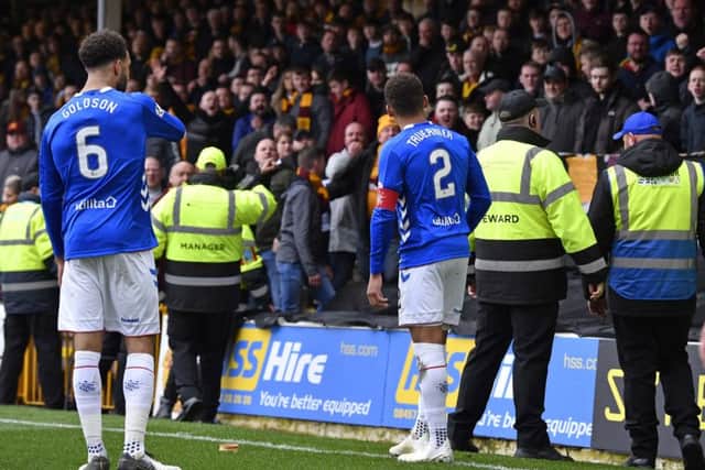 Rangers captain James Tavernier spots an object thrown from the Motherwell fans as he goes to take a throw-in. Picture: SNS