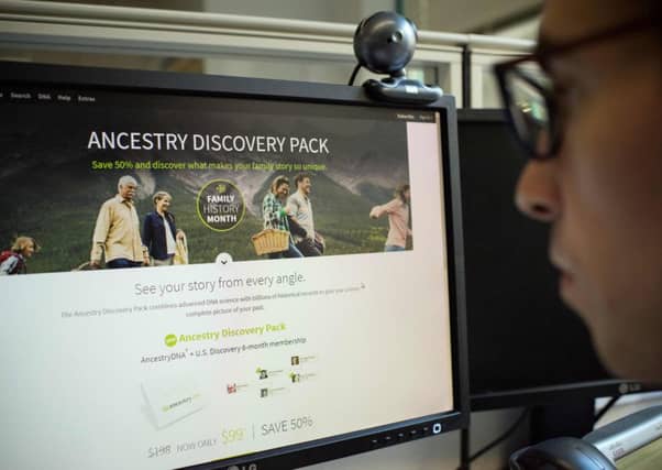 A journalist watches a website offering DNA testing