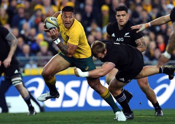 Australia full-back Israel Folau, left, is set to have his contract terminated over his latest anti-gay rant. Picture: William West/AFP/Getty Images