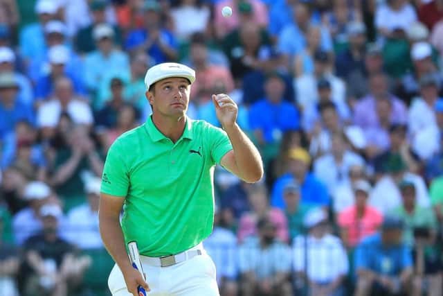 Bryson DeChambeau catches his golf ball on the 15th hole during the first round. Picture: Getty Images