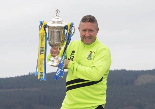 John Robertson is hoping to get his hands on the Scottish Cup for real next month. Picture: Craig Foy/SNS