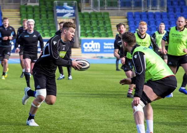 Huw Jones, who will be on the bench for Glasgow, limbers up in training for the clash with Leinster. Picture: Bill Murray/SNS/SRU