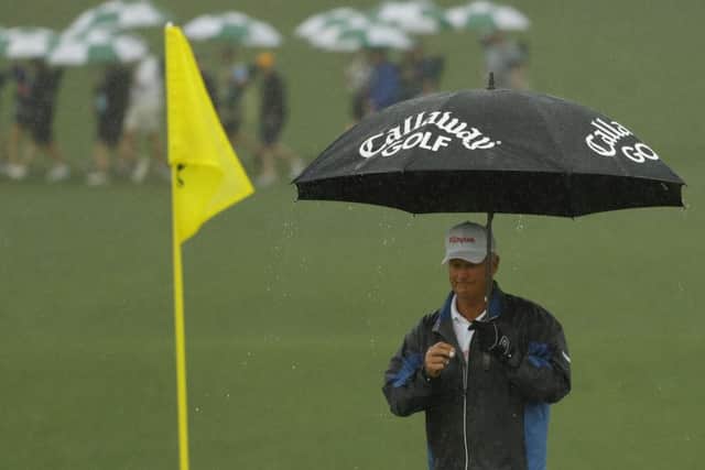 Sandy Lyle needed his brolly on his way to a second-round 75. Picture: AP Photo/Matt Slocum