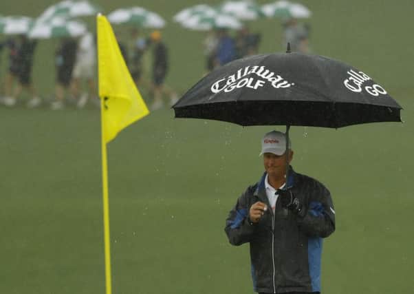 Sandy Lyle needed his brolly on his way to a second-round 75. Picture: AP Photo/Matt Slocum
