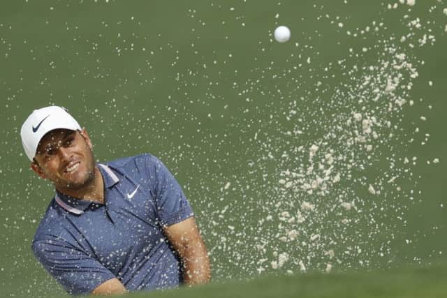 Francesco Molinari plays from a bunker on the second hole on his way to a five-under-par round of 67 in the second round of the Masters. Picture: Matt Slocum/AP