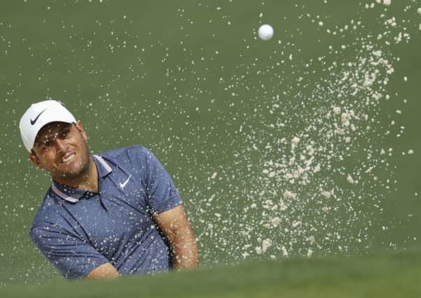 Francesco Molinari plays from a bunker on the second hole on his way to a five-under-par round of 67 in the second round of the Masters. Picture: Matt Slocum/AP