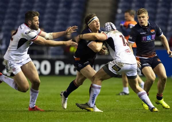 Edinburgh's Hamish Watson (centre) is stopped in his tracks against Ulster. Picture: Bill Murray/SNS