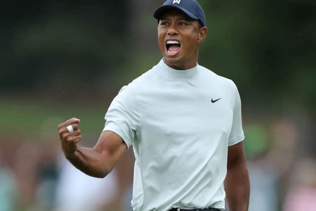 Tiger Woods celebrates after making a putt for birdie on the 15th green at Augusta National. Picture: Gegtty Images