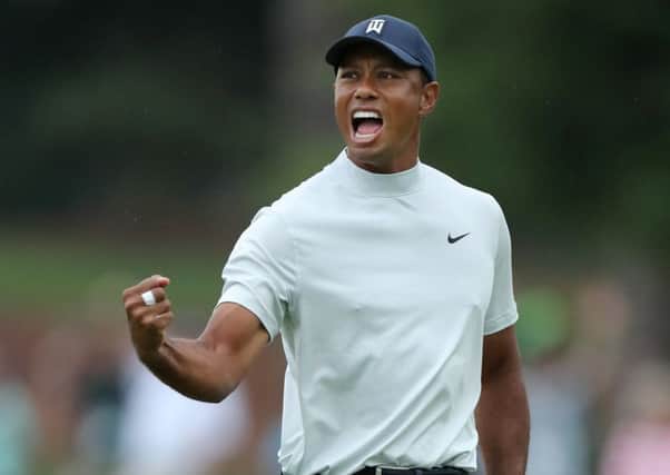 Tiger Woods celebrates after making a putt for birdie on the 15th green at Augusta National. Picture: Gegtty Images