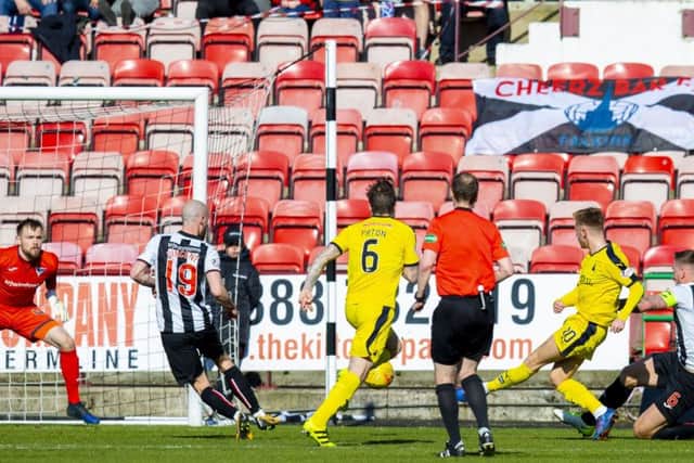 Falkirk's Davis Keillor-Dunn fires past Dunfermline's Ryan Scully. Pic: SNS/Bruce White