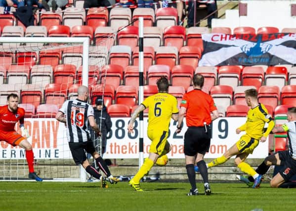 Falkirk's Davis Keillor-Dunn fires past Dunfermline's Ryan Scully. Pic: SNS/Bruce White