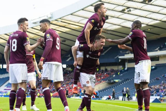 Celebration time for Hearts' Sean Clare, Steven MacLean, Olly Lee, Bobby Burns and Uche Ikpeazu. Picture: Alan Harvey/SNS
