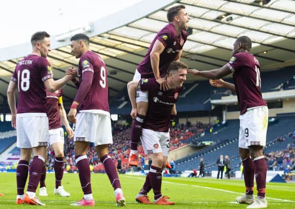 Celebration time for Hearts' Sean Clare, Steven MacLean, Olly Lee, Bobby Burns and Uche Ikpeazu. Picture: Alan Harvey/SNS