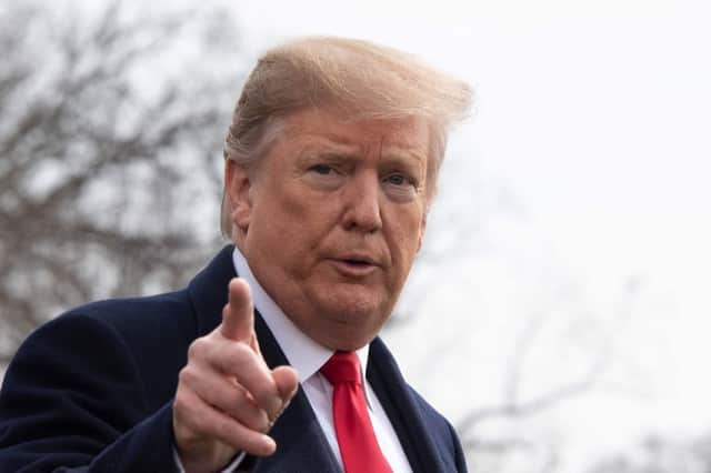 US President Donald Trump speaks before departing the White House in Washington, DC, on March 20, 2019. (Photo by Jim WATSON / AFP)JIM WATSON/AFP/Getty Images
