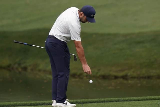 Francesco Molinari, who was two clear at the time, takes a penalty drop at the 12th. Picture: Getty Images