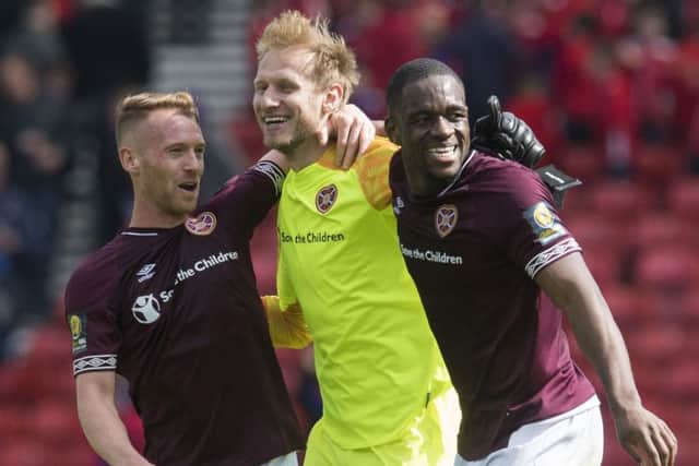 Goalkeeper Zdenek Zlamal celebrates Hearts' semi-final victory with Ollie Bozanic, left, and Uche Ikpeazu. Picture: SNS.