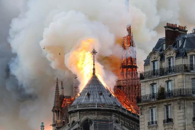 Smoke and flames rise during a fire at the landmark Notre-Dame Cathedral in central Paris on April 15, 2019, potentially involving renovation works being carried out at the site, the fire service said. (Photo by FRANCOIS GUILLOT / AFP)FRANCOIS GUILLOT/AFP/Getty Images