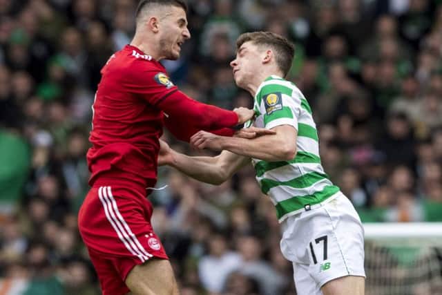 Celtic's Ryan Christie suffers an injury after a clash with Aberdeen's Dominic Ball. Picture: SNS/Alan Harvey