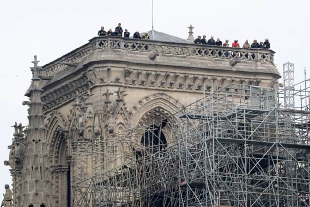 Fire fighers on the roof of the building. Picture: Gareth Fuller/PA Wire