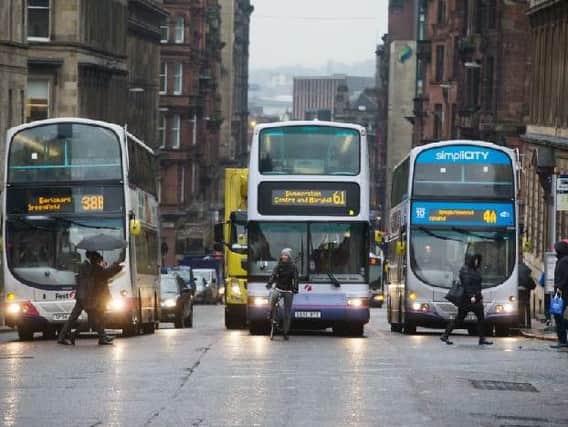 Operators complain they have to stump up 60 per cent of the cost of retrofitting bus engines. Picture: John Devlin