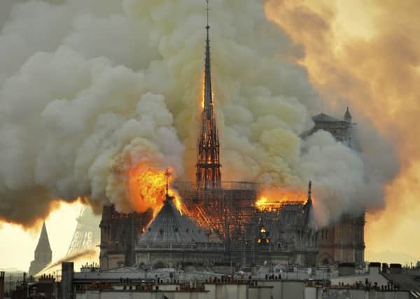 An inferno that raged through Notre Dame Cathedral for more than 12 hours destroyed its spire and its roof, but spared its twin medieval bell towers. Picture: AP Photo/Thierry Mallet