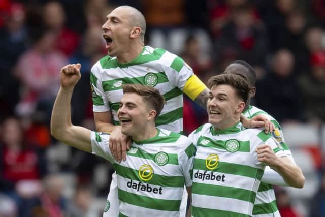 James Forrest celebrates his goal with Scott Brown (top) and Kieran Tierney (right). Picture: SNS Group