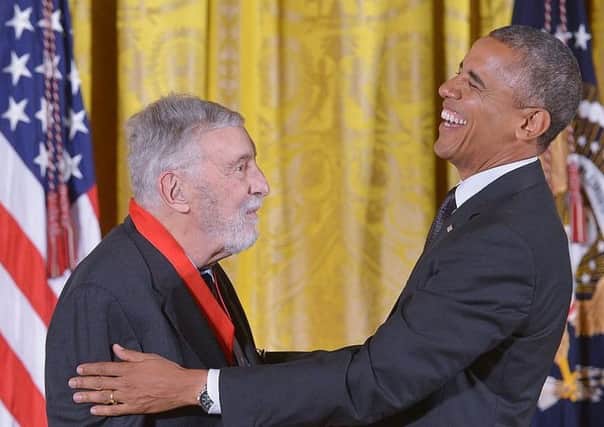 Barack Obama presents the  National Humanities Medal to David Brion Davis in 2014(Picture: MANDEL NGAN/AFP/Getty Images)