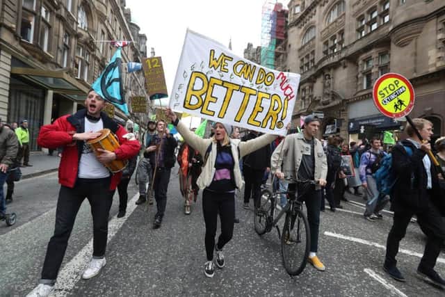 Climate protesters join Extinction Rebellion Scotland as they form a road block on the North Bridge. Picture: Andrew Milligan/PA Wire