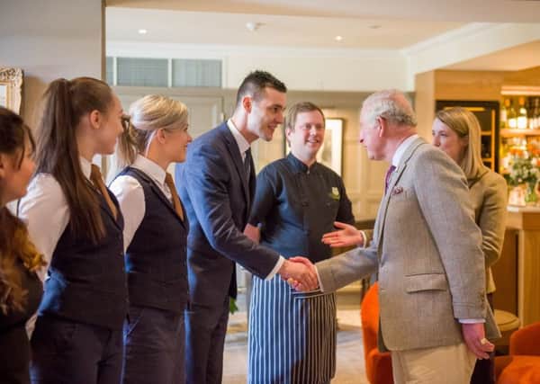 Prince Charles meets members of the Douneside House team