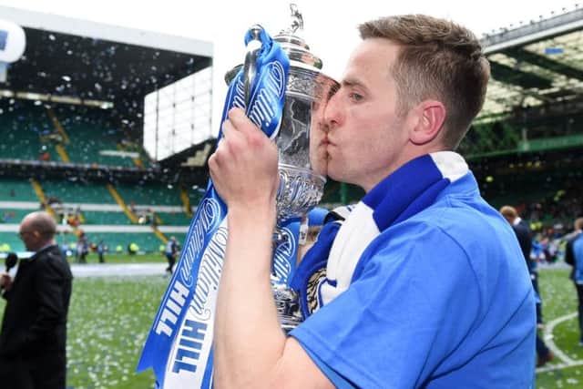 Steven MacLean plants a kiss on the William Hill Scottish Cup trophy after St Johnstone's win at Hampden in 2014.