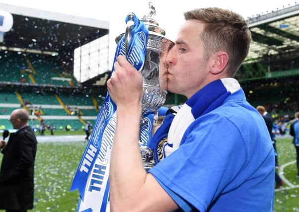 Steven MacLean plants a kiss on the William Hill Scottish Cup trophy after St Johnstone's win at Hampden in 2014.