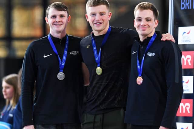 Ross Murdoch, left, Adam Peaty and Craig Benson show off their medals after the men's 50m breaststroke. Pic: Craig Williamson/SNS