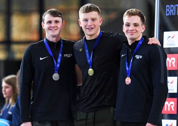 Ross Murdoch, left, Adam Peaty and Craig Benson show off their medals after the men's 50m breaststroke. Pic: Craig Williamson/SNS