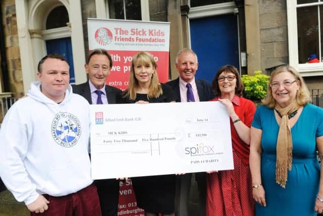Bradley Welsh visits the Sick Kids Foundation in 2014 to hand over 42,500 pounds he raised from sparring in the boxing ring for 24 hours. The money was used to purchase computers with special screens with eye recognition for children with disabilities who are unable to speak.