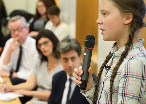 Greta Thunberg speaks to an audience including Environment Secretary Michael Gove and Labour MP Ed Miliband (Picture: Leon Neal/Getty)
