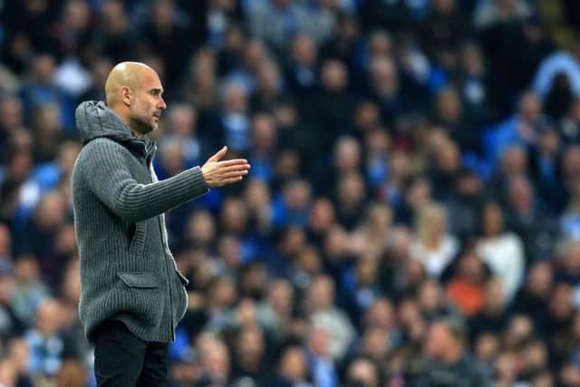 Pep Guardiola looks on as Manchester City crash out of the Champions League at the hands of Tottenham Hotspur