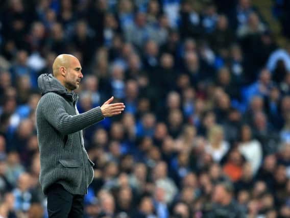 Pep Guardiola looks on as Manchester City crash out of the Champions League at the hands of Tottenham Hotspur