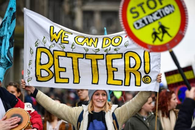 EDINBURGH,SCOTLAND - APRIL 16: Climate change protesters block one of the main roads into Edinburgh's city centre on April 16, 2019 in Edinburgh, Scotland. Supporters of Extinction Rebellion Scotland targeted North Bridge as part of the Extinction Rebellion, which has taken place in a number of cities across the UK. (Photo by Jeff J Mitchell/Getty Images)