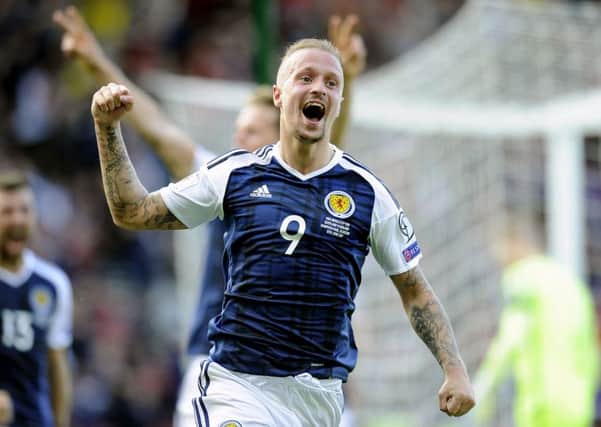 Leigh Griffiths celebrates for Scotland after scoring against England. Pic: Michael Gillen