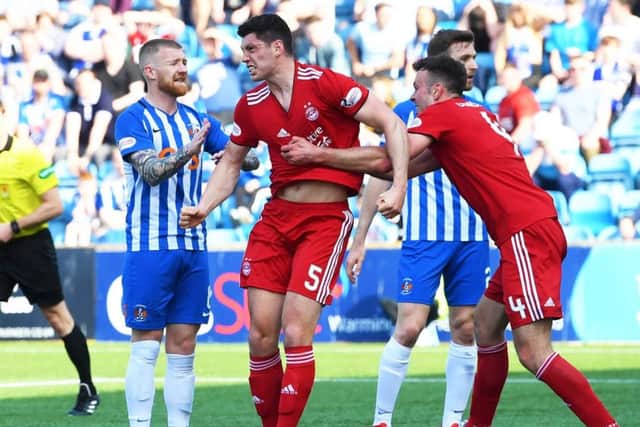 Scott McKenna show's his delight after putting Aberdeen ahead. Pic: SNS/Gary Hutchison