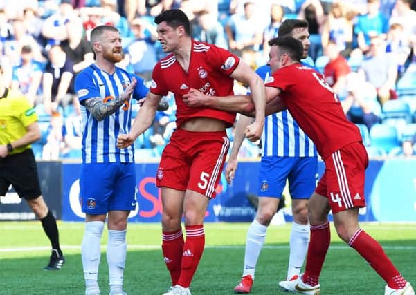 Scott McKenna show's his delight after putting Aberdeen ahead. Pic: SNS/Gary Hutchison