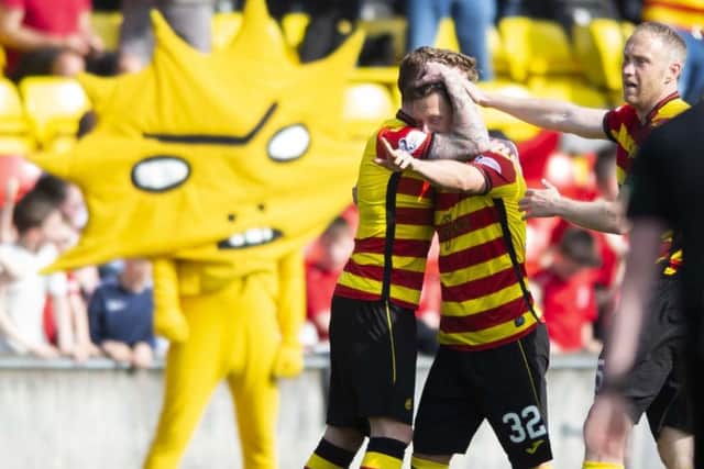 Partick's Joe Cardle celebrates with teammates. Pic: SNS/Sammy Turner
