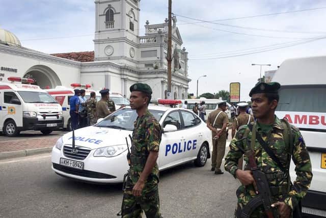 Sri Lankan Army soldiers secure the area around a church.(AP Photo/Eranga Jayawardena)