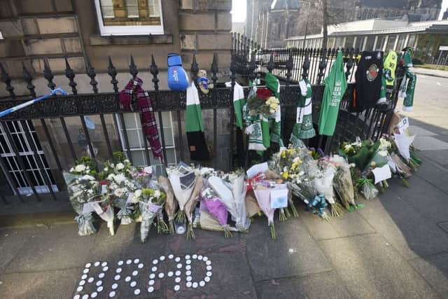 Floral tributes and were left near the scene where Bradley Welsh was shot and killed on Wednesday evening on Chester Street. Picture: Greg Macvean