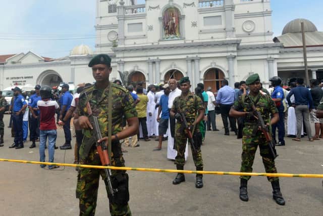 Sri Lankan security personnel keep watch outside the church premises following a blast at the St. Anthony's Shrine in Kochchikade in Colombo on April 21, 2019. (Photo by ISHARA S. KODIKARA / AFP)