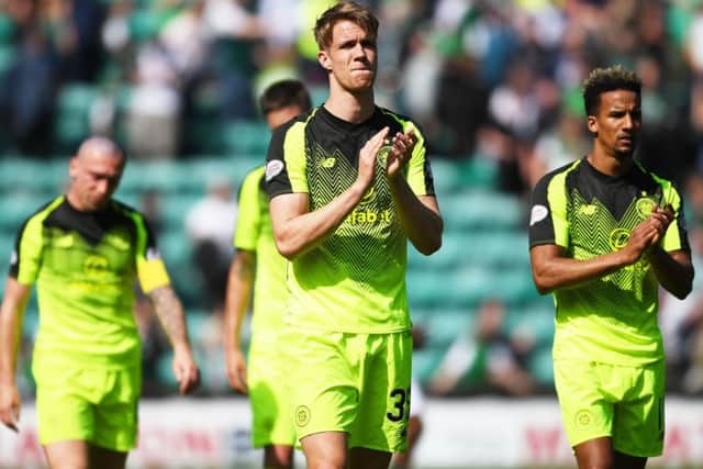 Kristoffer Ajer applauds the travelling Celtic fans but his manager questioned his players' attitude. Picture: SNS Group