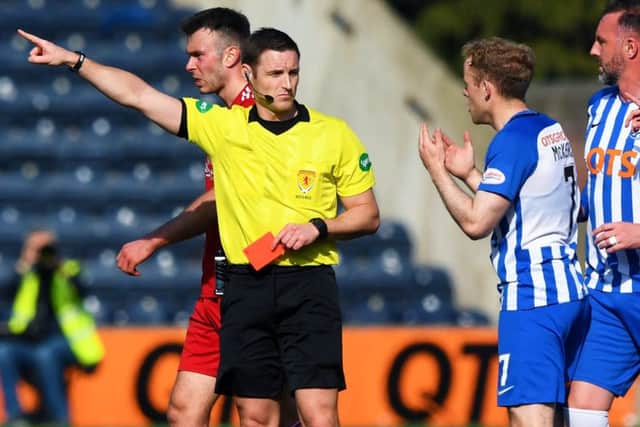 Referee Steven McLean brandishes his third red card of the afternoon, this time to Kilmarnock's Rory McKenzie. Picture: Gary Hutchison/SNS